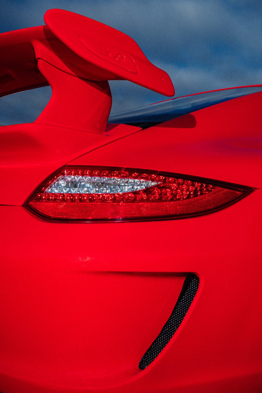 Porsche 911 GT3 taillight detail in Guards Red with Swan Neck spoiler visible above