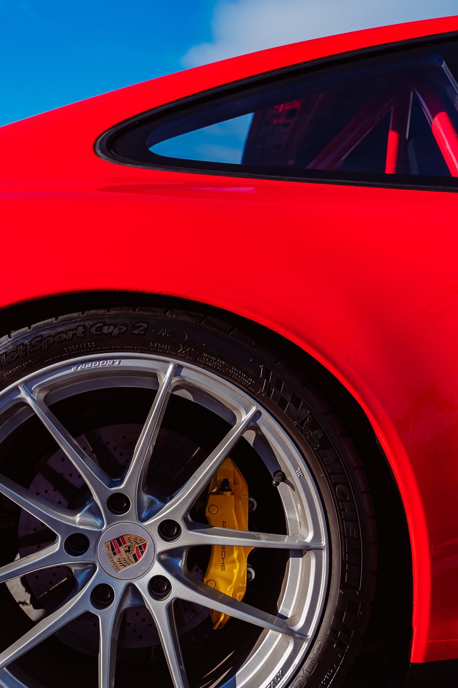 Porsche 911 GT3 center-lock wheel with yellow Porsche brake caliper and Michelin Pilot Sport Cup 2 tire