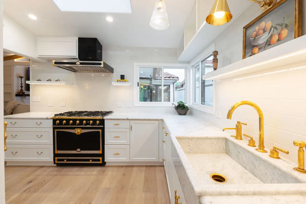 Wide view of Newport Beach kitchen showing La Cornue range, subway tile and white oak floors