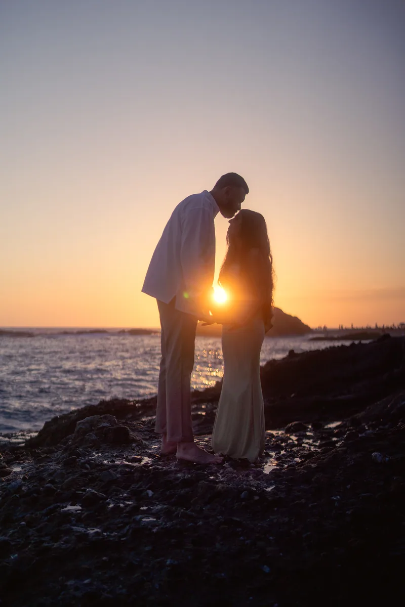 Ronak and Khushbu silhouetted at sunset, Treasure Island Beach proposal in Laguna Beach